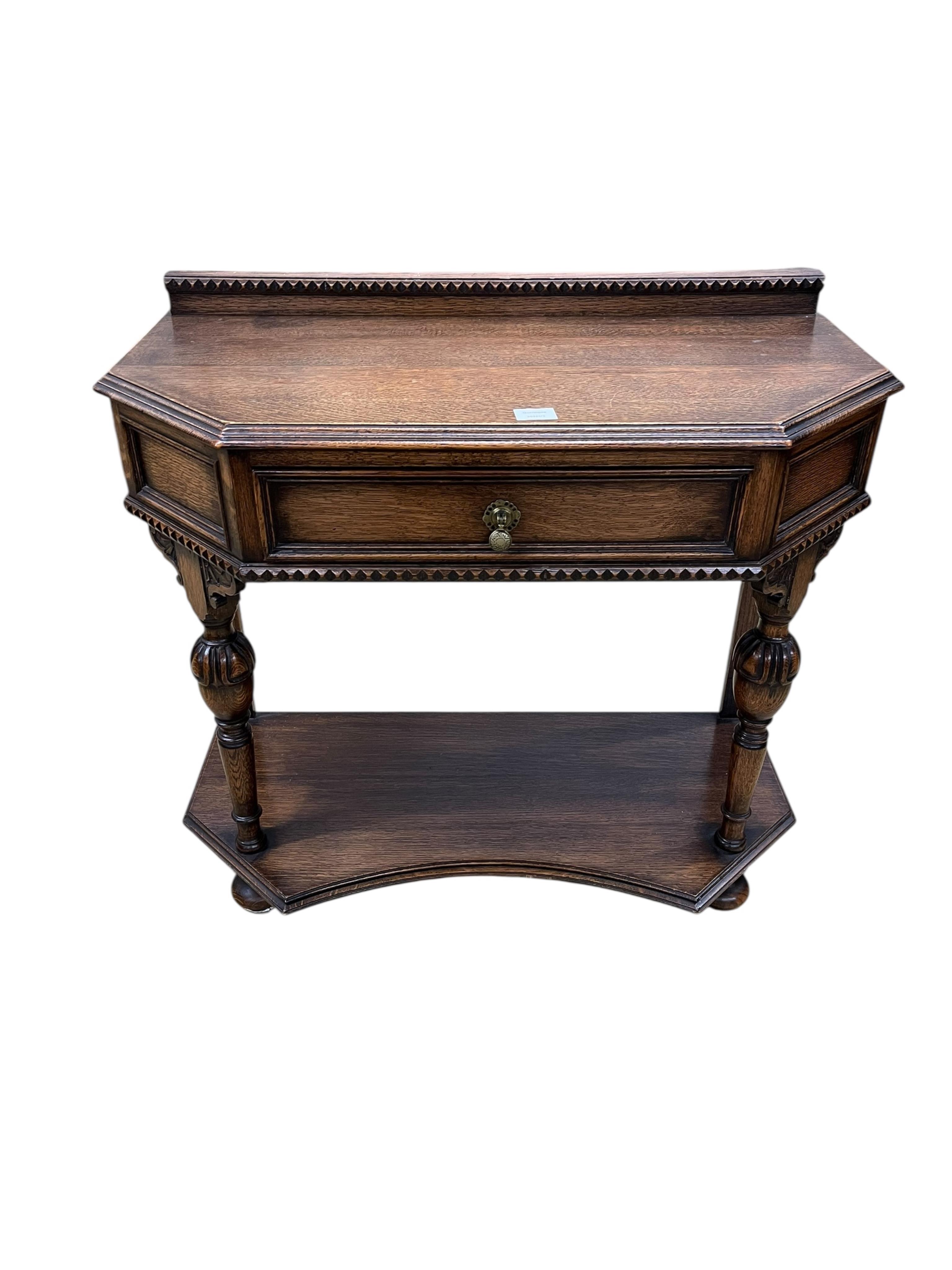 A Jacobean Revival oak two tier side table, width 90cm, depth 46cm, height 82cm